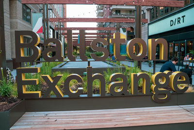 Information sign on railing against building