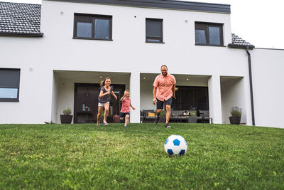 People playing soccer on field