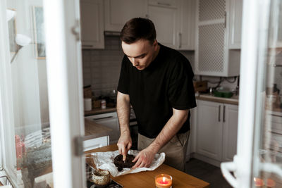 Side view of man working at home
