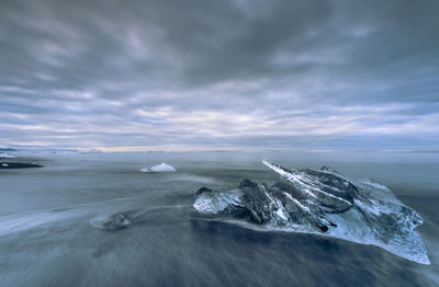 Scenic view of sea against sky during winter