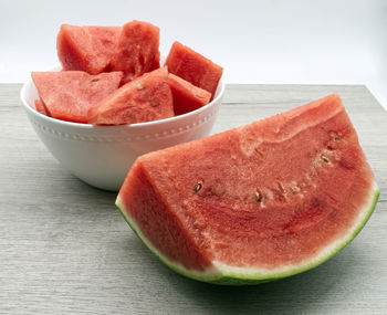 Close-up of chopped fruit in bowl on table