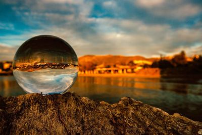 Scenic view of lake against sky during sunset