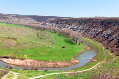 Winding river scenery in the springtime . river surrounded by hills