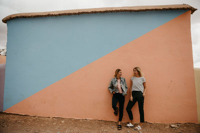 People standing against wall