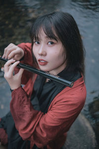 Portrait of young woman in water