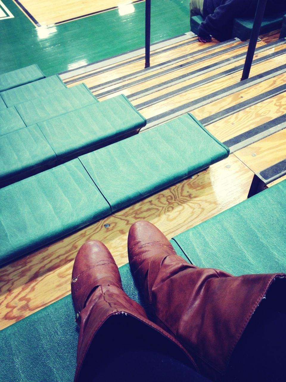 low section, person, personal perspective, human foot, shoe, indoors, high angle view, lifestyles, relaxation, legs crossed at ankle, jeans, men, flooring, barefoot, sitting, leisure activity, footwear