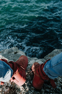 Low section of person on shore