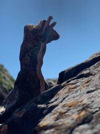 Low angle view of rock formation against clear sky