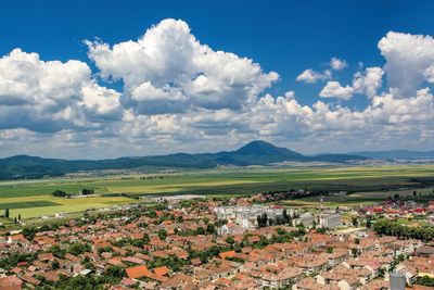 Scenic view of town against sky