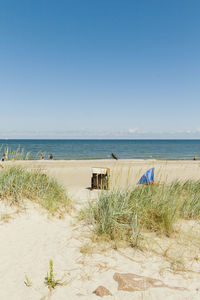 Scenic view of beach against clear sky