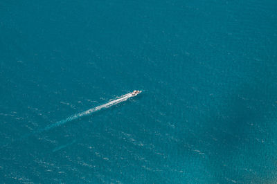 Helicopter view of a boat in the sea