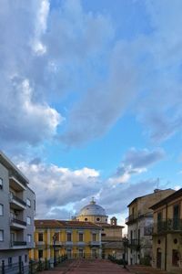 Houses against sky in city