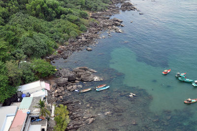 High angle view of boats on sea shore