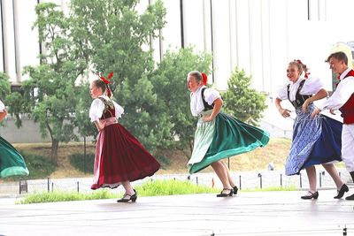 People walking in traditional clothing