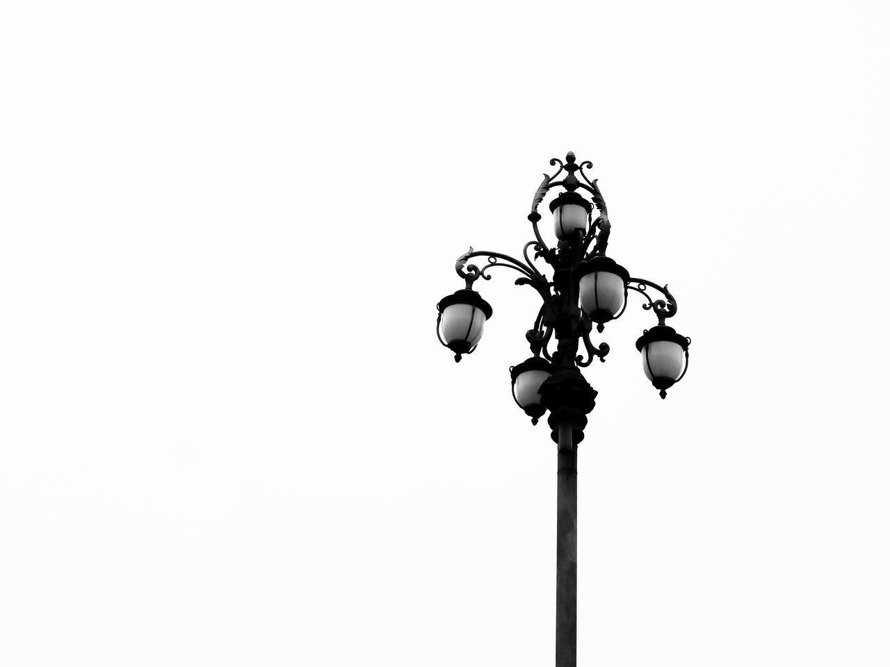 CLOSE-UP OF STREET LIGHT AGAINST CLEAR SKY