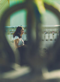Woman standing in mirror