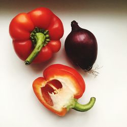 High angle view of bell peppers against white background