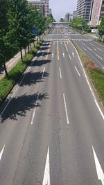 High angle view of road amidst trees in city