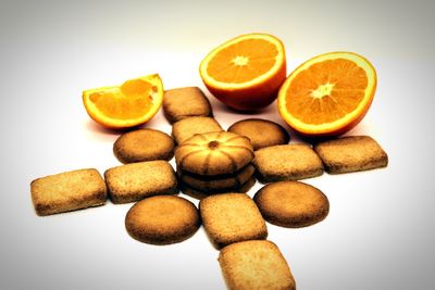 Close-up of orange slices against white background