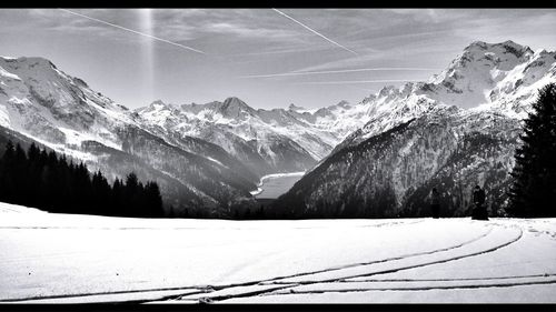 Scenic view of snowcapped mountains against sky