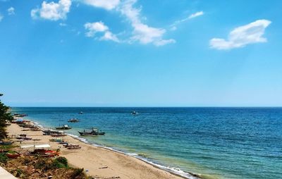 Scenic view of sea against blue sky