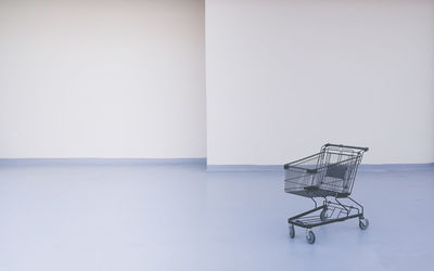 Empty shopping cart in room