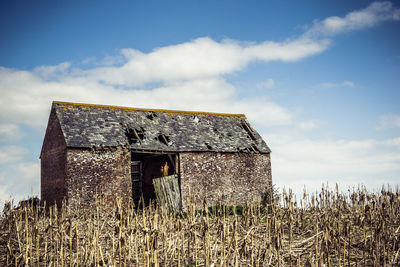 Abandoned built structure against the sky