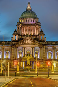 The imposing belfast city hall illuminated at twilight