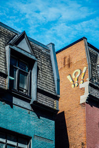 Low angle view of old house against sky