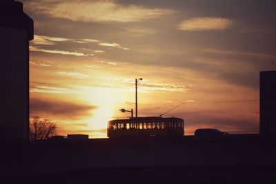 Silhouette of built structure at sunset