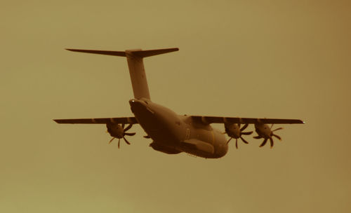 Low angle view of airplane against sky