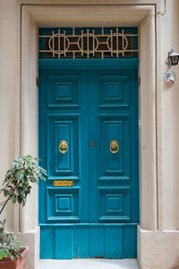Traditional wooden, vintage painted turquoise door in malta