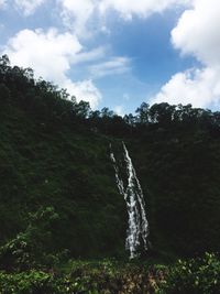 Scenic view of landscape against cloudy sky