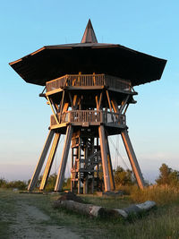 Built structure on field against sky