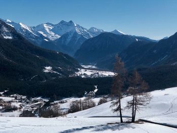 Scenic view of snowcapped mountains against sky