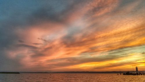 Scenic view of sea against dramatic sky