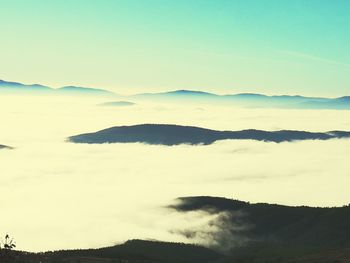 Scenic view of silhouette mountains against sky during sunset