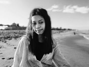 Portrait of beautiful young woman on beach