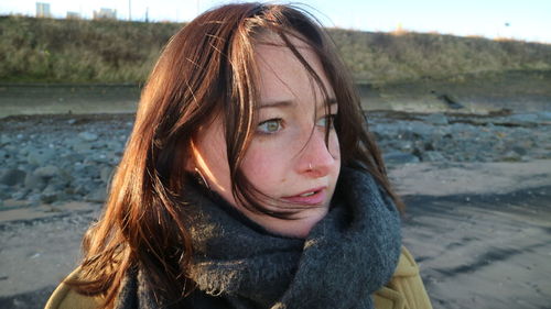 Portrait of a beautiful young woman outdoors