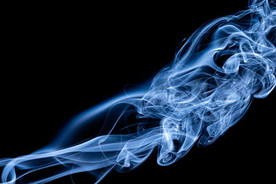 Blue color abstract smoke on black background