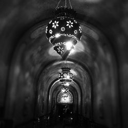 Low angle view of illuminated tunnel