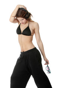 Young woman standing against white background