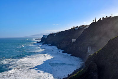 Panoramic view of sea against blue sky