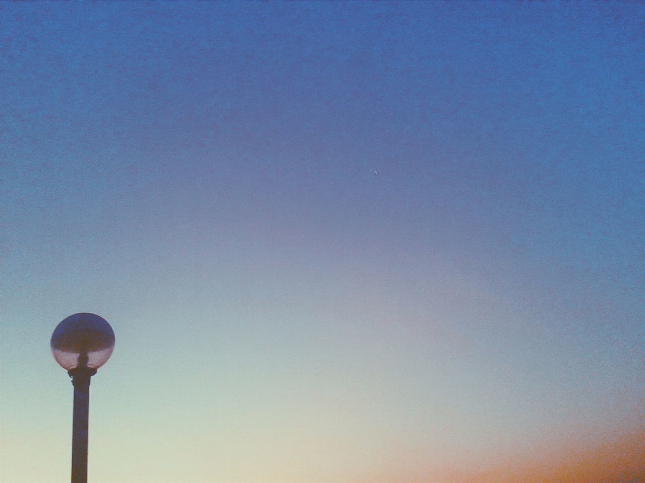 copy space, clear sky, low angle view, street light, lighting equipment, blue, moon, illuminated, outdoors, no people, nature, night, tranquility, dusk, scenics, beauty in nature, pole, sky, tranquil scene, high section