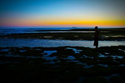 Scenic view of sea at sunset