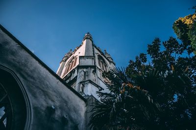 Low angle view of building against blue sky