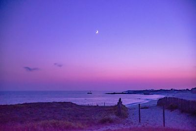 Scenic view of sea against sky at sunset