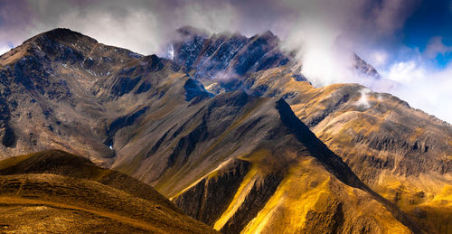 Panoramic view of mountain range against sky