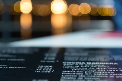 Close-up of illuminated text on table