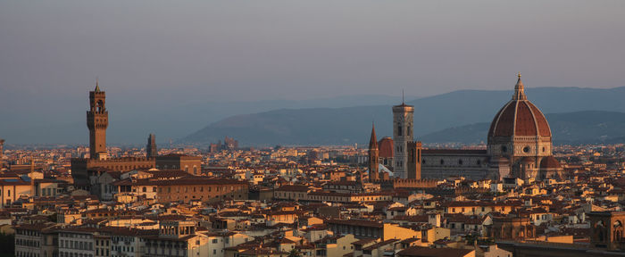 High angle view of city buildings against sky